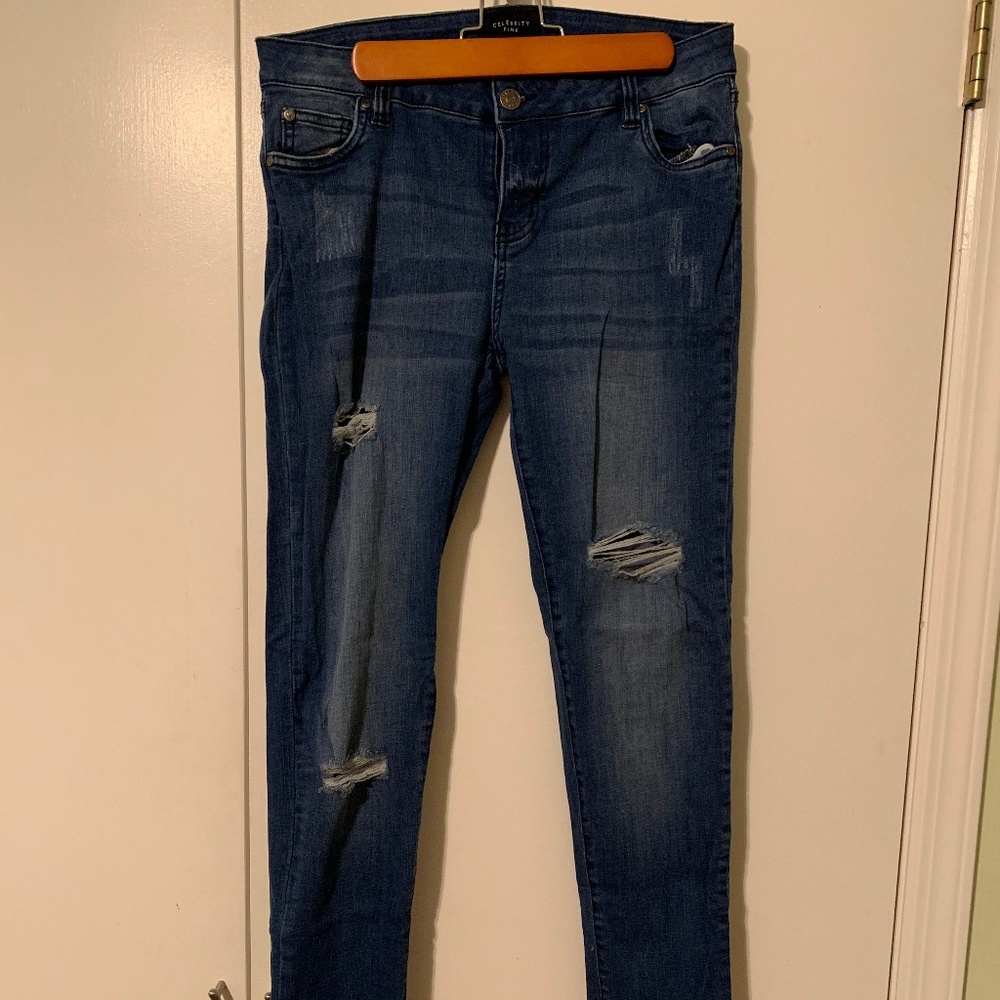 Distressed blue jeans